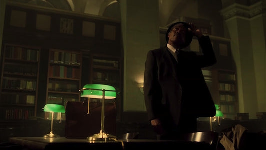 What is the story behind the green desk lamp that appears on film so often? Who made green banker lamps?